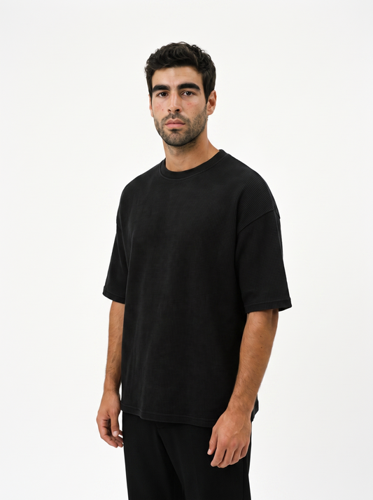 BLANC Relaxed Oversized Tee Black worn by model on white studio background