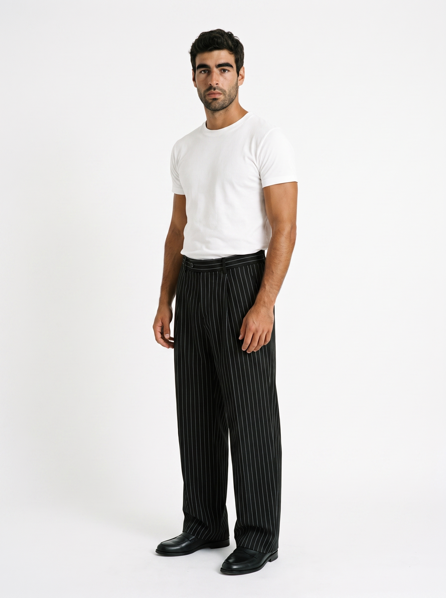 BLANC Black Pinstripe Pants worn by model on white studio background