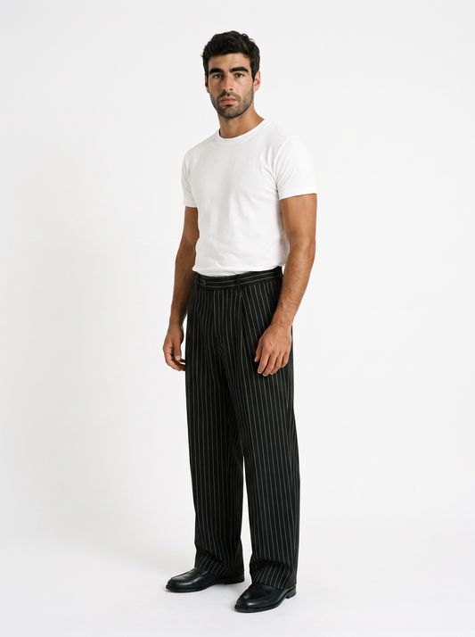 BLANC Black Pinstripe Pants worn by model on white studio background